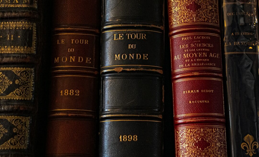 a row of books sitting on top of a shelf